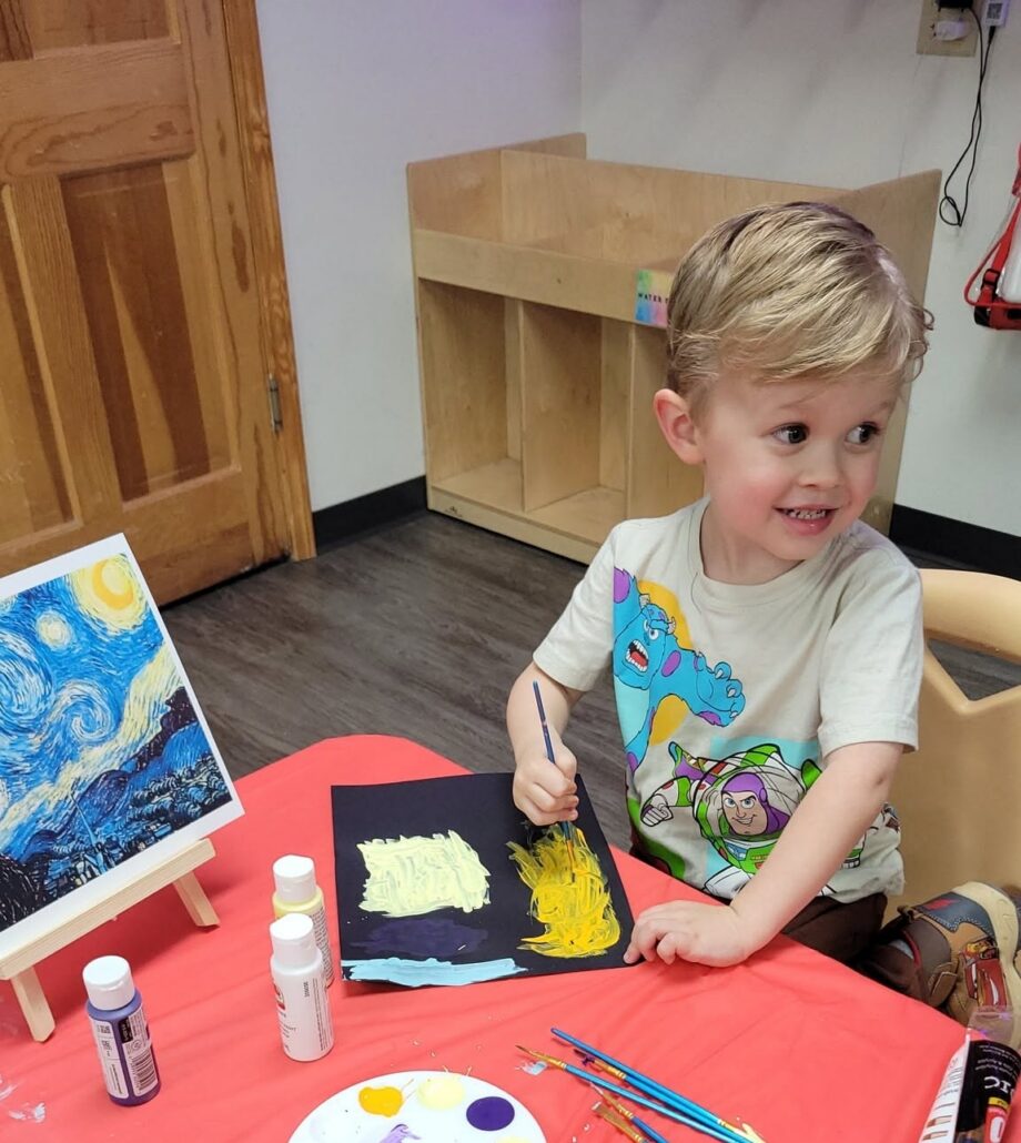 child painting at preschool and daycare of 339 wild horse