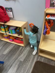child playing in classroom 503 cordova