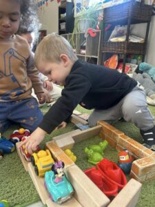 children playing with toys inside at cadence academy preschool and daycare raintree in charlotte, north carolina