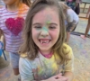 child playing outside in chalk smiling at cadence academy wylie texas