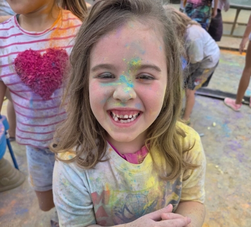 child playing outside in chalk smiling at cadence academy wylie texas