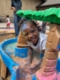 child playing outside with chalk at cadence academy wylie texas