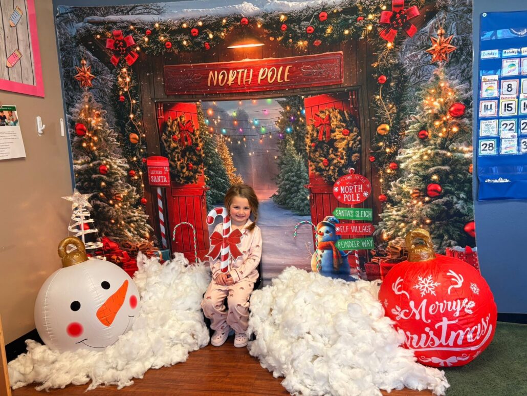 child posing during christmas time at cadence academy preschool at southaven