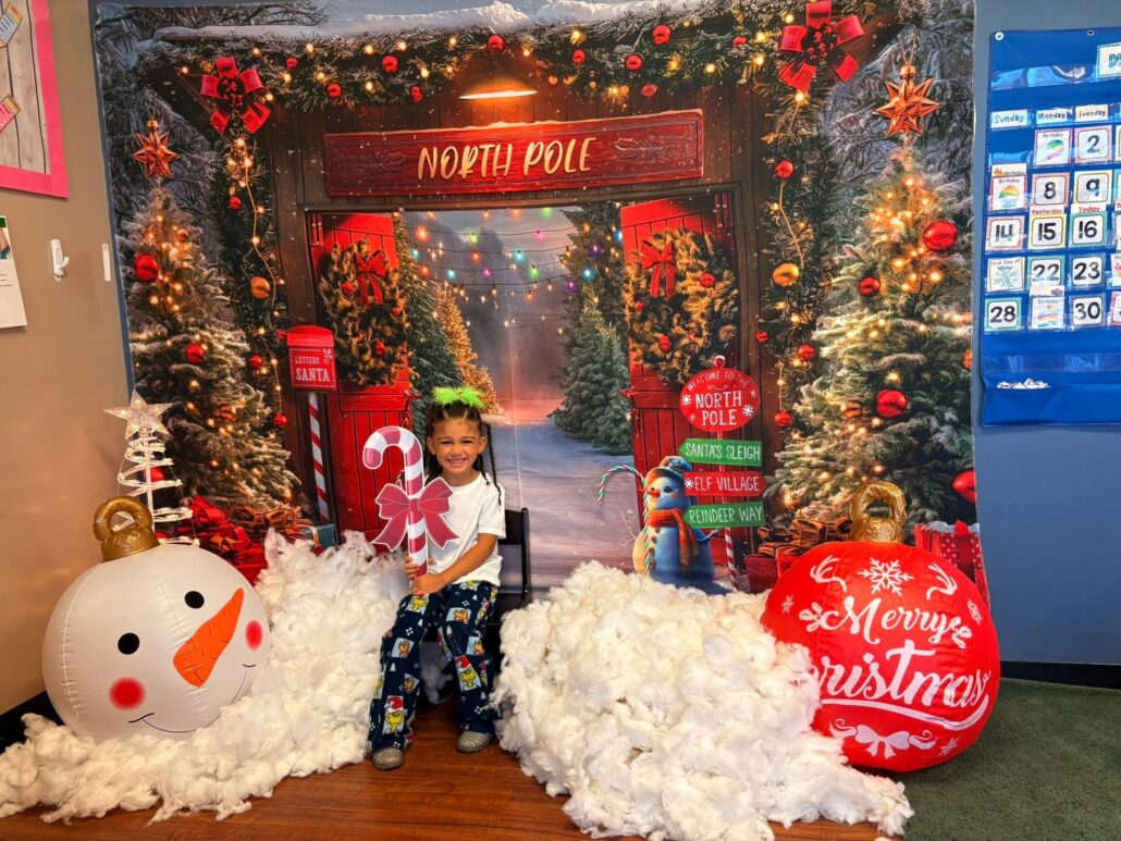 child posing for christmas time at cadence academy preschool at southaven