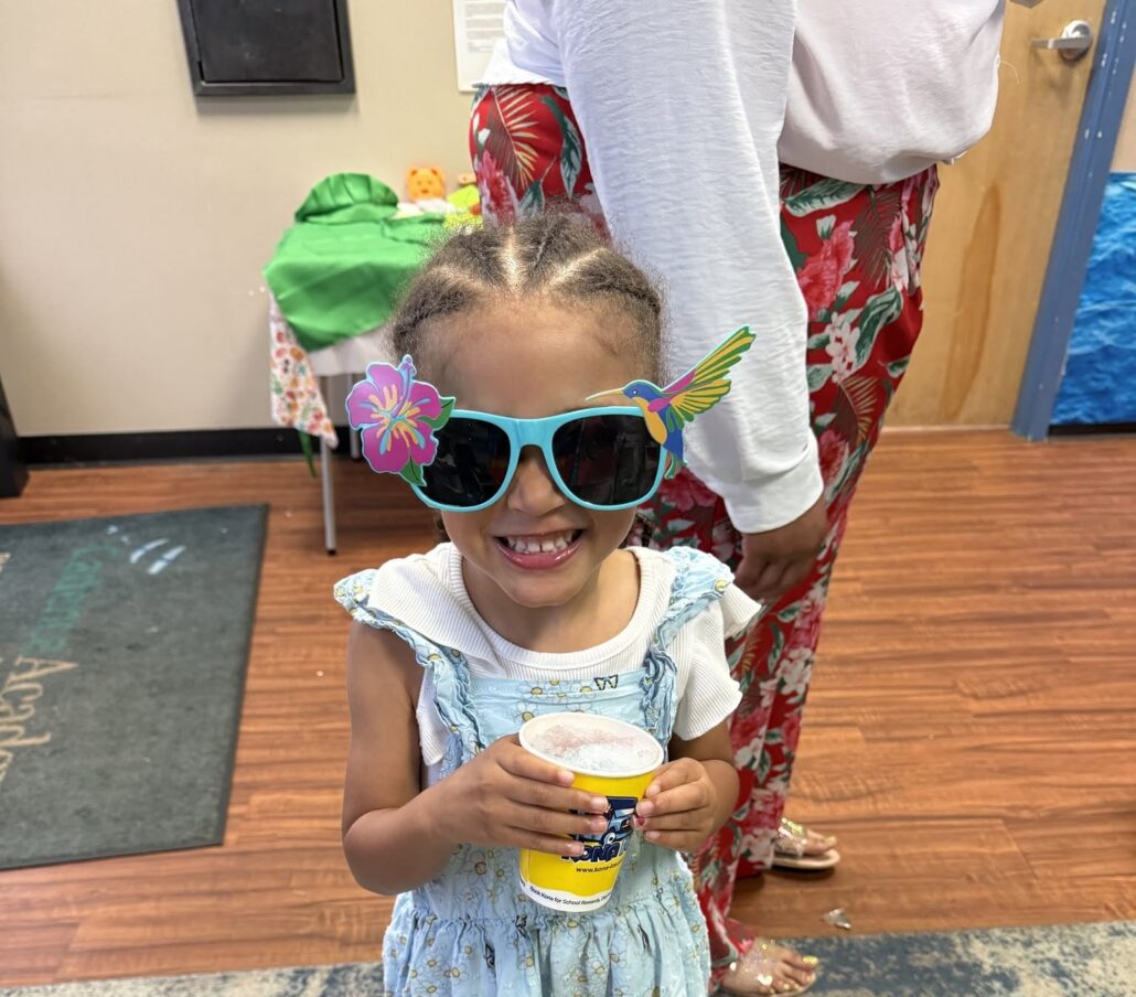 child posing with glasses at cadence academy preschool at southaven
