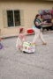 child pushing box at parade at preschool and daycare of 339 wild horse