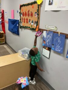 child reaching for classroom tool 503 cordova