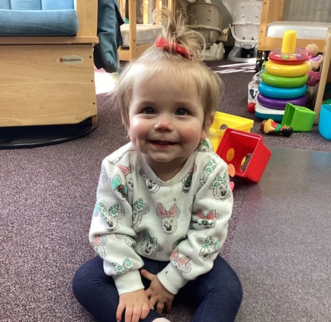 infant smiling and sitting at preschool and daycare at cadence academy preschool smyrna, delaware