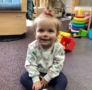 infant smiling and sitting at preschool and daycare at cadence academy preschool smyrna, delaware