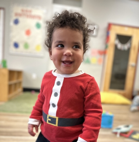 child smiling during christmas at cadence academy preschool eastfield in huntersville, North Carolina