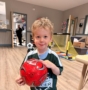 child smiling with soccer ballat preschool and daycare in grapevine texas