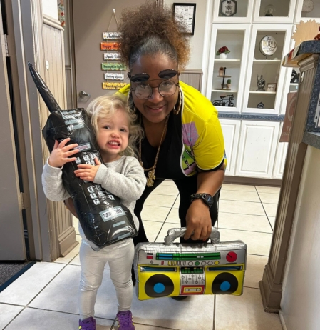 child smiling with teacher at preschool and daycare at cadence academy preschool forney, texas