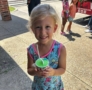 child smiling with treat at preschool and daycare at cadence academy preschool forney, texas