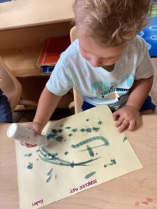child using dotter paint at preschool and daycare at 365 cypress
