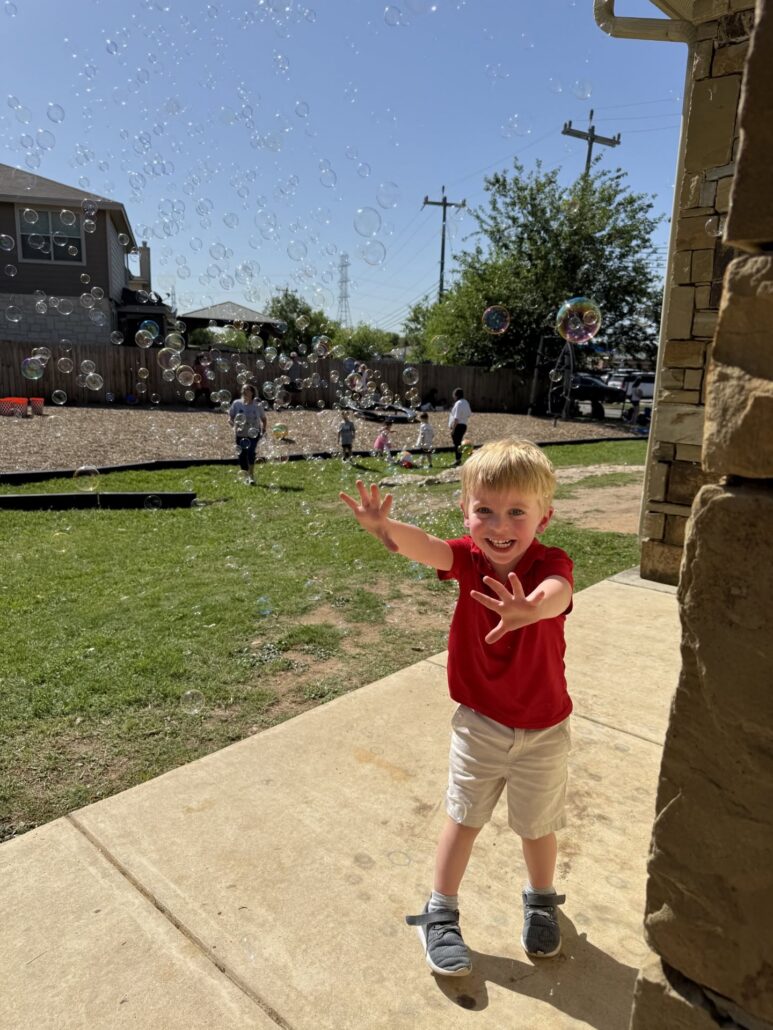 child with bubbles at preschool and daycare of 339 Wild Horse