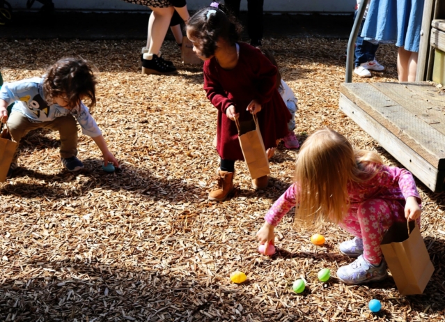children collecting easter eggs outside at Cadence Academy Preschool and Daycare Yelm Highway in Olympia, Washington