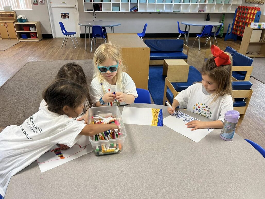 children drawing together at preschool and daycare at cadence academy preschool in the colony texas