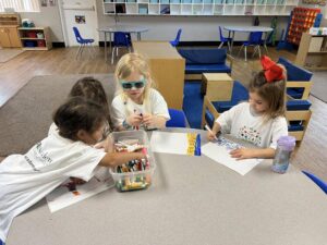 children drawing together at preschool and daycare at cadence academy preschool in the colony texas