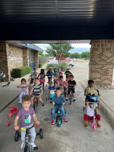 children during bike for st jude at preschool and daycare at cadence academy preschool in the colony texas