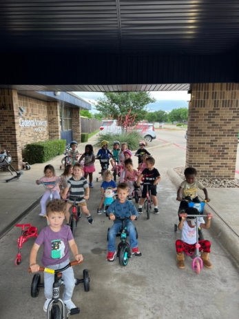 children during bike for st jude at preschool and daycare at cadence academy preschool in the colony texas
