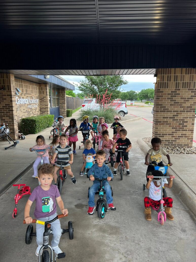 children during bike for st jude at preschool and daycare at cadence academy preschool in the colony texas