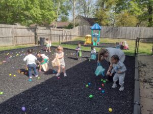 Children doing easter egg hunt at preschool and daycare at Cadence Academy Preschool Olive Branch, Mississippi