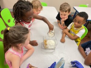 Children doing group hands on learning at preschool and daycare at Cadence Academy Preschool Olive Branch, Mississippi