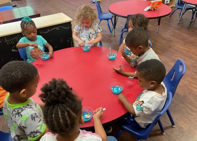 Children at desk learning at preschool and daycare at Cadence Academy Preschool Olive Branch, Mississippi