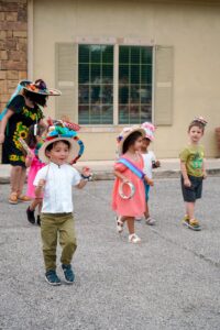 children in parade at preschool and daycare of 339 wild horse