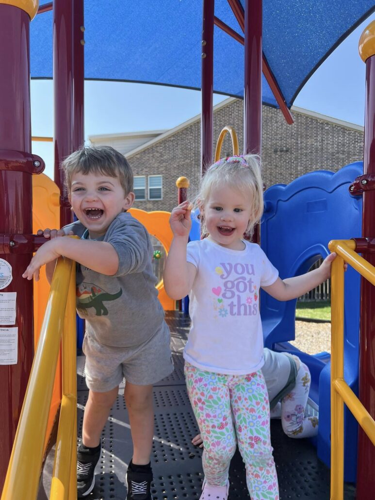 children laughing on playground at preschool and daycare at cadence academy preschool in the colony texas