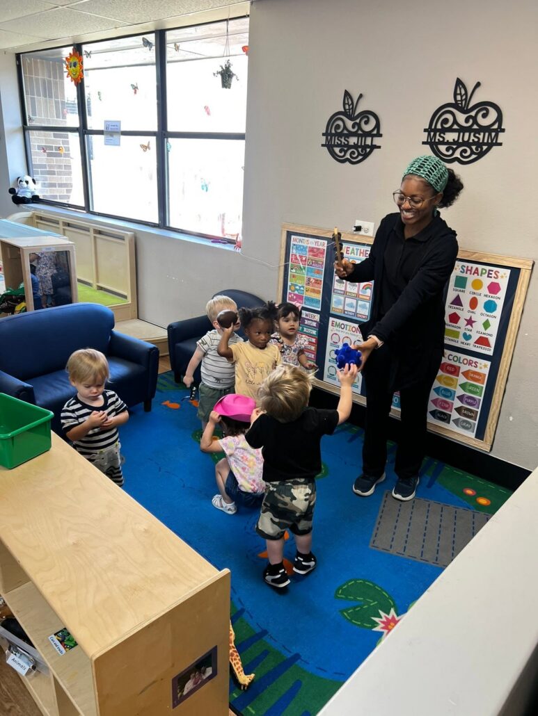 children laughing with teacher at preschool and daycare at cadence academy preschool in the colony texas