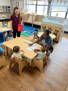 children learning with teacher at preschool and daycare at cadence academy preschool in the colony texas