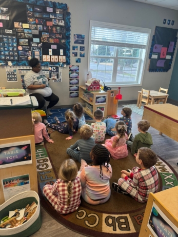 children listening to teacher in classroom circle at preschool and daycare cadence academy preschool 502 spring hill
