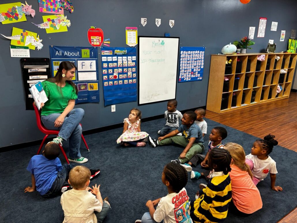 children listening to teacher during stories at cadence academy preschool at southaven