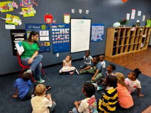 children listening to teacher during stories at cadence academy preschool at southaven