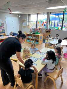 children listening to teacher instructions at preschool and daycare at cadence academy preschool in the colony texas