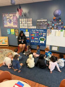 children listening to teacher read at cadence academy preschool at southaven
