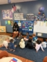 children listening to teacher read at cadence academy preschool at southaven