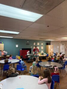 children listening to teacher speak at preschool and daycare at cadence academy preschool in the colony texas