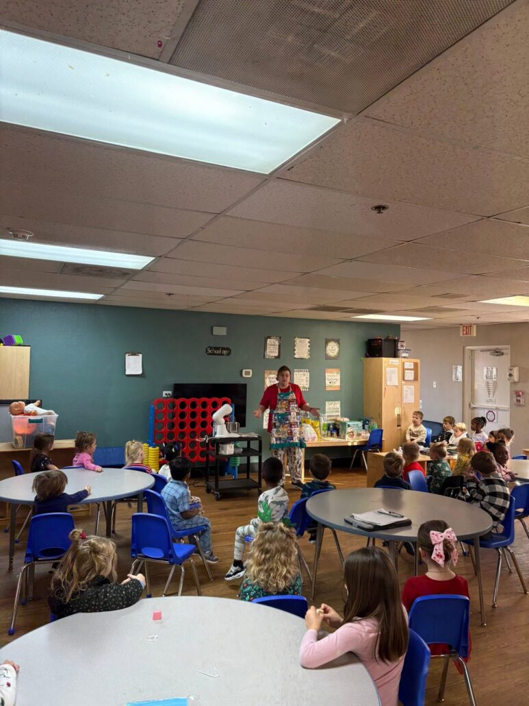 children listening to teacher speak at preschool and daycare at cadence academy preschool in the colony texas