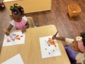 Children painting together at preschool and daycare at Cadence Academy Preschool Olive Branch, Mississippi
