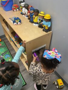 children playing in classroom 503 cordova