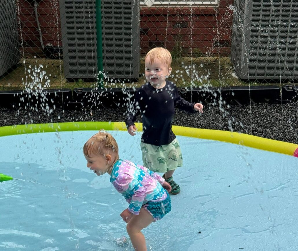 children playing on splashpad outside at preschool and daycare cadence academy preschool 502 spring hill