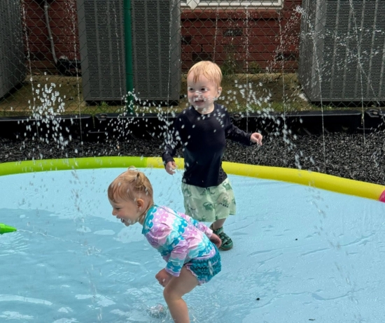 children playing on splashpad outside at preschool and daycare cadence academy preschool 502 spring hill