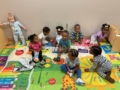 Children playing on carpet at preschool and daycare at Cadence Academy Preschool Olive Branch, Mississippi