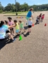 children playing tug a war outside