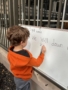 children practicing writing at preschool and daycare at cadence academy preschool galleria