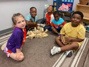 children sitting with toys 503 cordova