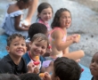 children smiling outside during water day