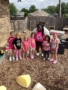children smiling outside with teacher at preschool and daycare at cadence academy preschool in the colony texas